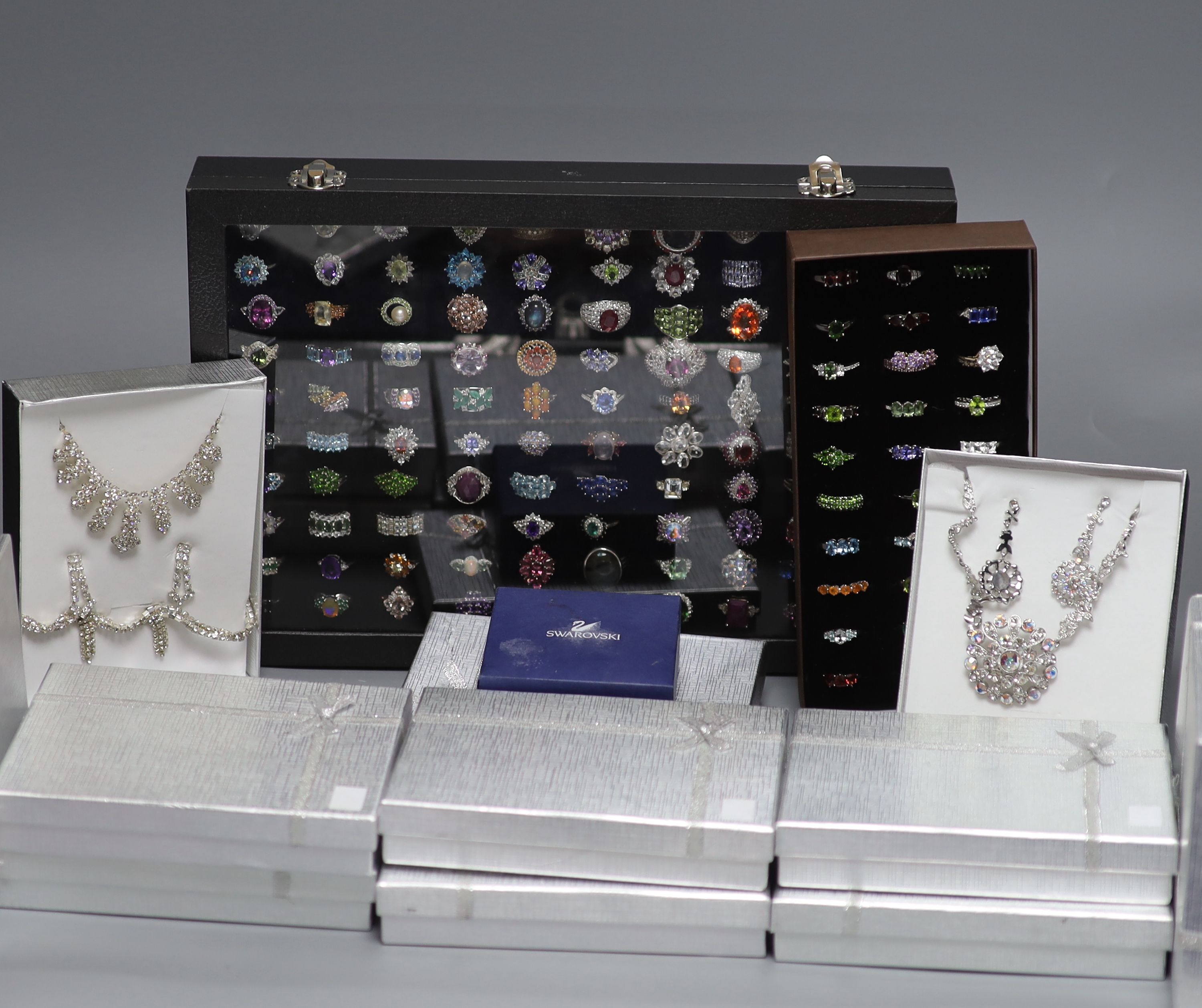 A large quantity of Swarovski costume jewellery and one hundred and thirty mainly 925 rings.